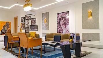 Luxury Apartment | Living area | Flat-screen TV