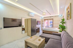 Comfort Studio | Living area | 40-inch flat-screen TV with digital channels