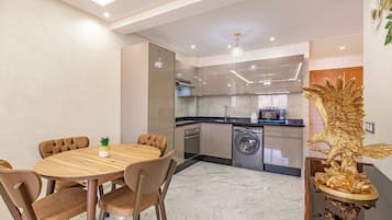 Superior Apartment | Private kitchen | Full-sized fridge, microwave, oven, stovetop