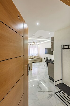 Family Apartment | Living area | 40-inch flat-screen TV with digital channels