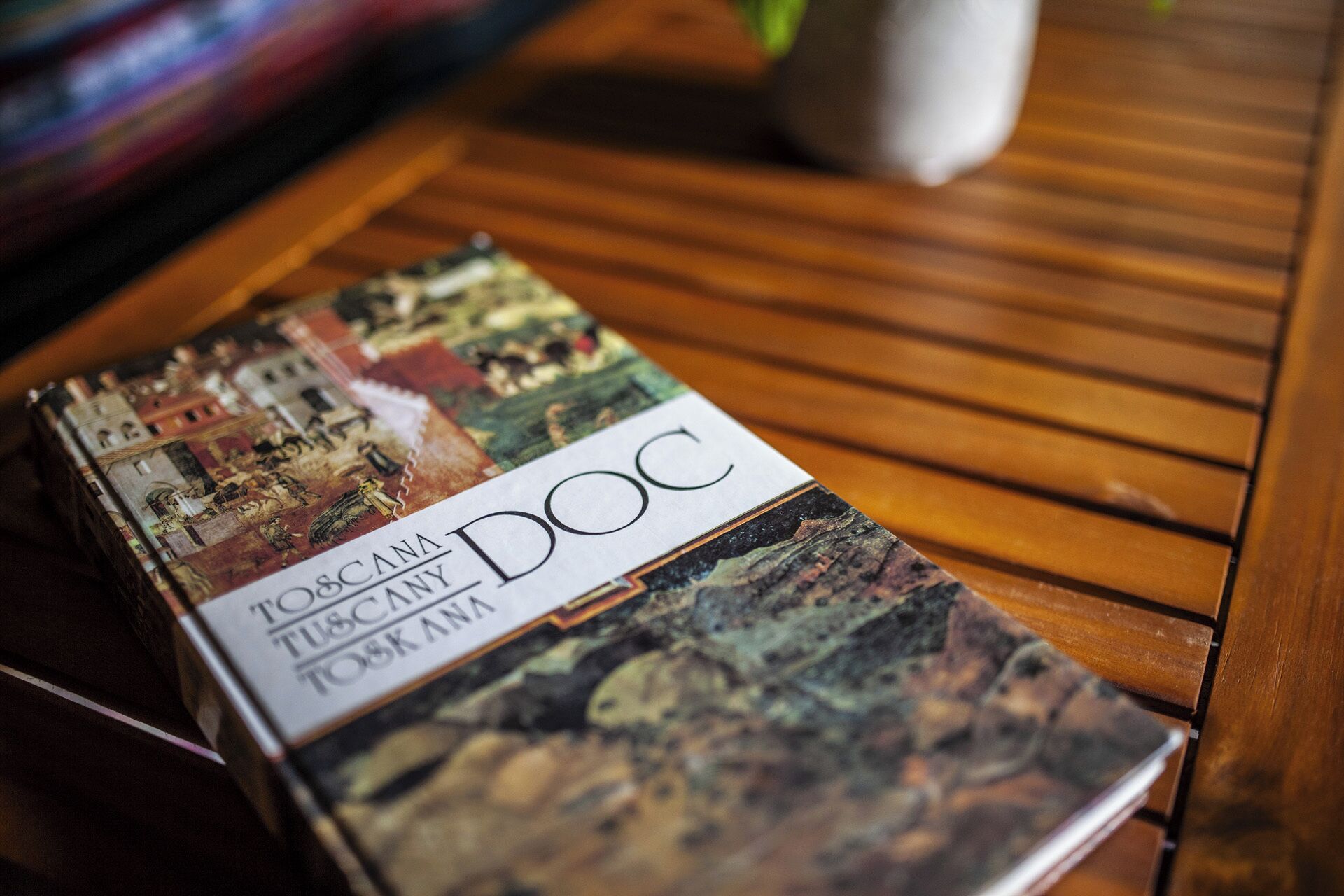 A book titled "Doc" on a wooden table.
