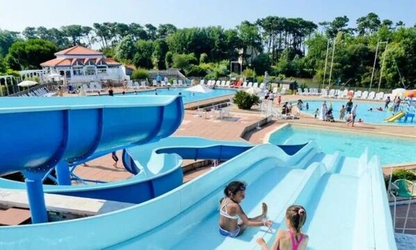 A water park with multiple slides and pools.