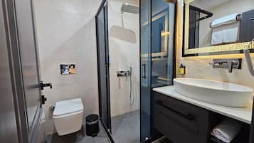 Shower, hair dryer, slippers, towels