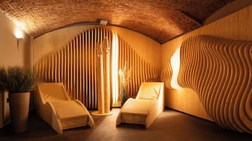 Relax in a serene space with a curved ceiling, wooden paneling, and a wavy wall design.