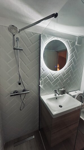Shower, hair dryer, towels, soap