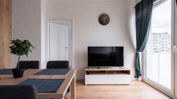 Classic Apartment, City View | Living area | 27-inch flat-screen TV with satellite channels, streaming services