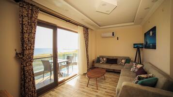 Suite, 1 Bedroom, Balcony, Sea View | Living area | LCD TV