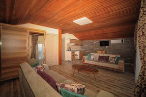 Honeymoon Penthouse, Balcony, Sea View | Living area | LCD TV