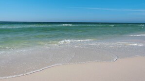 A beach with clear blue water and a sandy shore. - Gulf Front Condo in Gated Complex and Seasonal Beach Service (Destin)