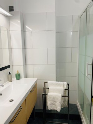 Shower, hair dryer, towels, soap