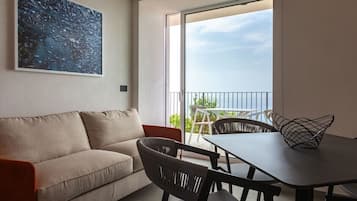 Apartment, Sea View | Living area | TV