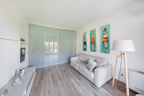 Apartment | Living area | 35-inch flat-screen TV with satellite channels