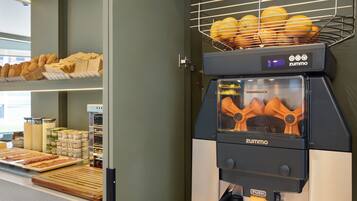 A bakery display with various baked goods and a bread oven.