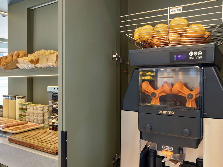 A bakery display with various baked goods and a bread oven.