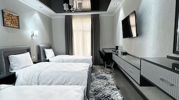 Habitación triple Deluxe, 3 habitaciones | Ropa de cama de alta calidad, edredón, camas Select Comfort y minibar