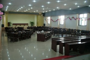 A large hall with rows of chairs and tables, likely for an event or gathering. - Huailai Diman Hot Spring Resort (Huailai)