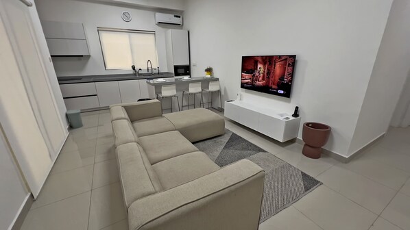 65-inch Smart TV with cable channels, Netflix, pay films - Bluerock Residences (Lekki)