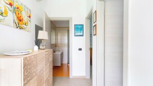 A modern kitchen with a built-in oven, a sink, and a countertop.