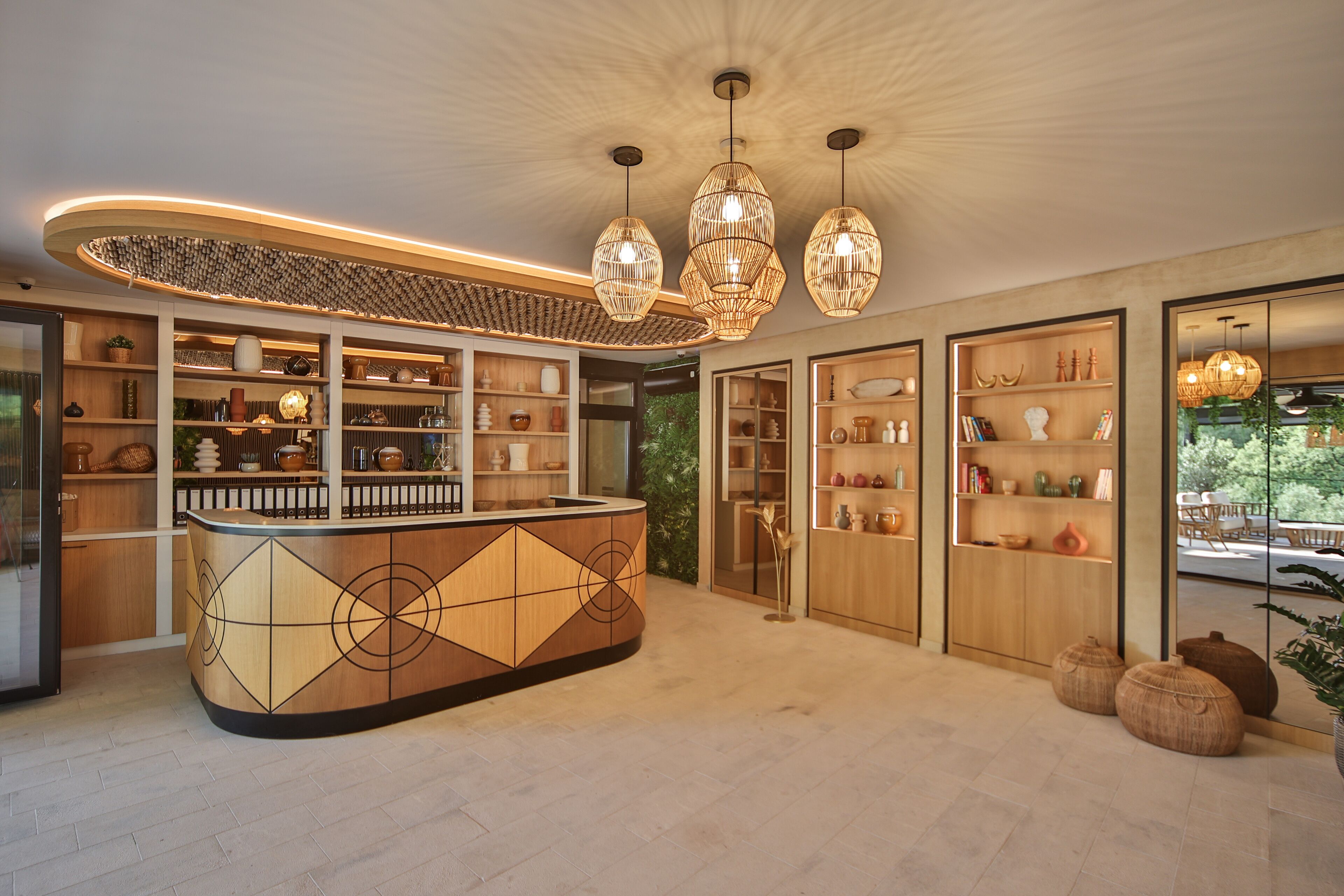 A modern kitchen with a central island, wooden shelving, and pendant lighting.