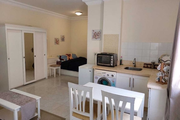 Deluxe Studio, Balcony, Pool View | Iron/ironing board, WiFi