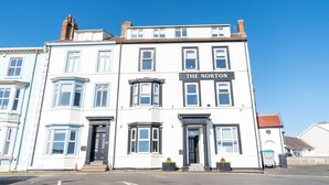 A white building with a sign reading "The Norton" on the front. - The Norton (Hartlepool)