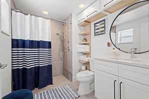 Shower, hair dryer, towels, soap