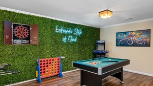 A room with a pool table, a dartboard, and a neon sign. - Lakefront Treehouse Retreat Minutes from Clemson University! (Seneca)