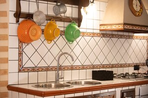 Fridge, microwave, stovetop, cookware/dishes/utensils