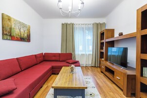 Dante Apartment | Living area | 80-cm Smart TV with cable channels