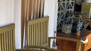 A wooden bench with a slatted seat and backrest, positioned outdoors. - Un Lugar Para Compartir en Familia (Allentown)