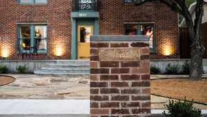 A brick building with a sign reading "The Madison."