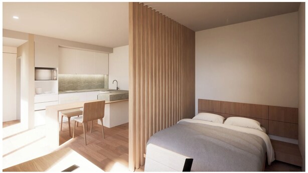 A modern hotel room with a separate dining area, a wooden headboard, and a minimalist design. - Anas inn (Ezeiza)