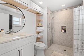 Shower, hair dryer, towels, soap