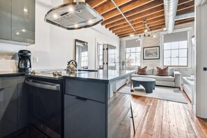 Fridge, microwave, oven, stovetop - Live the Jazz Life: Modern 4BR Condo in NOLA (New Orleans)
