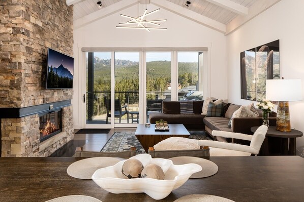 Relax in this cozy living space with a fireplace, flat-screen TV, and comfortable seating area.