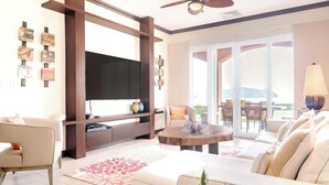 Uma sala de estar moderna com televisão de tela plana, um sofá, uma mesa de centro e uma área de jantar com cadeiras.
