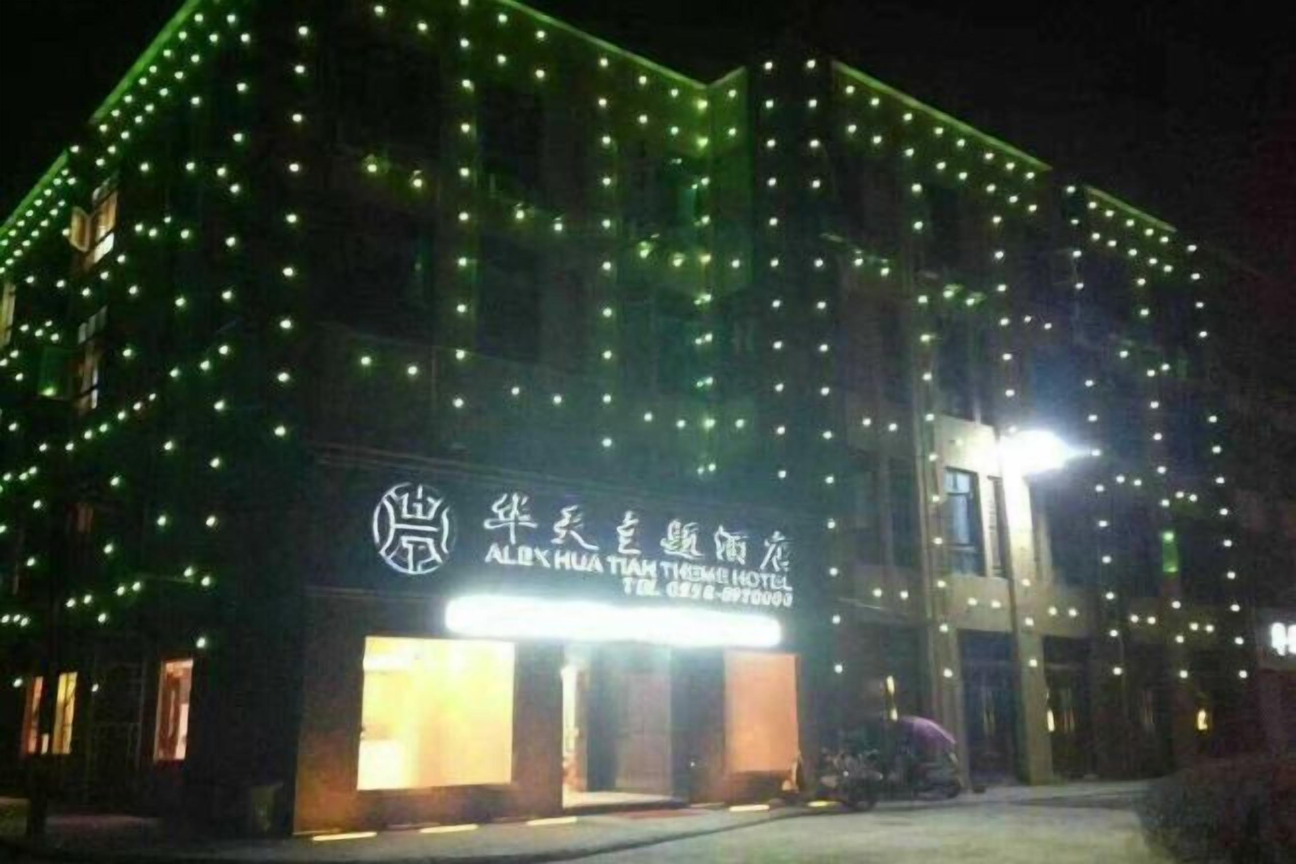 A building with a sign indicating it is the 'ALIBI HUA TEAM THAMES HOTEL.'