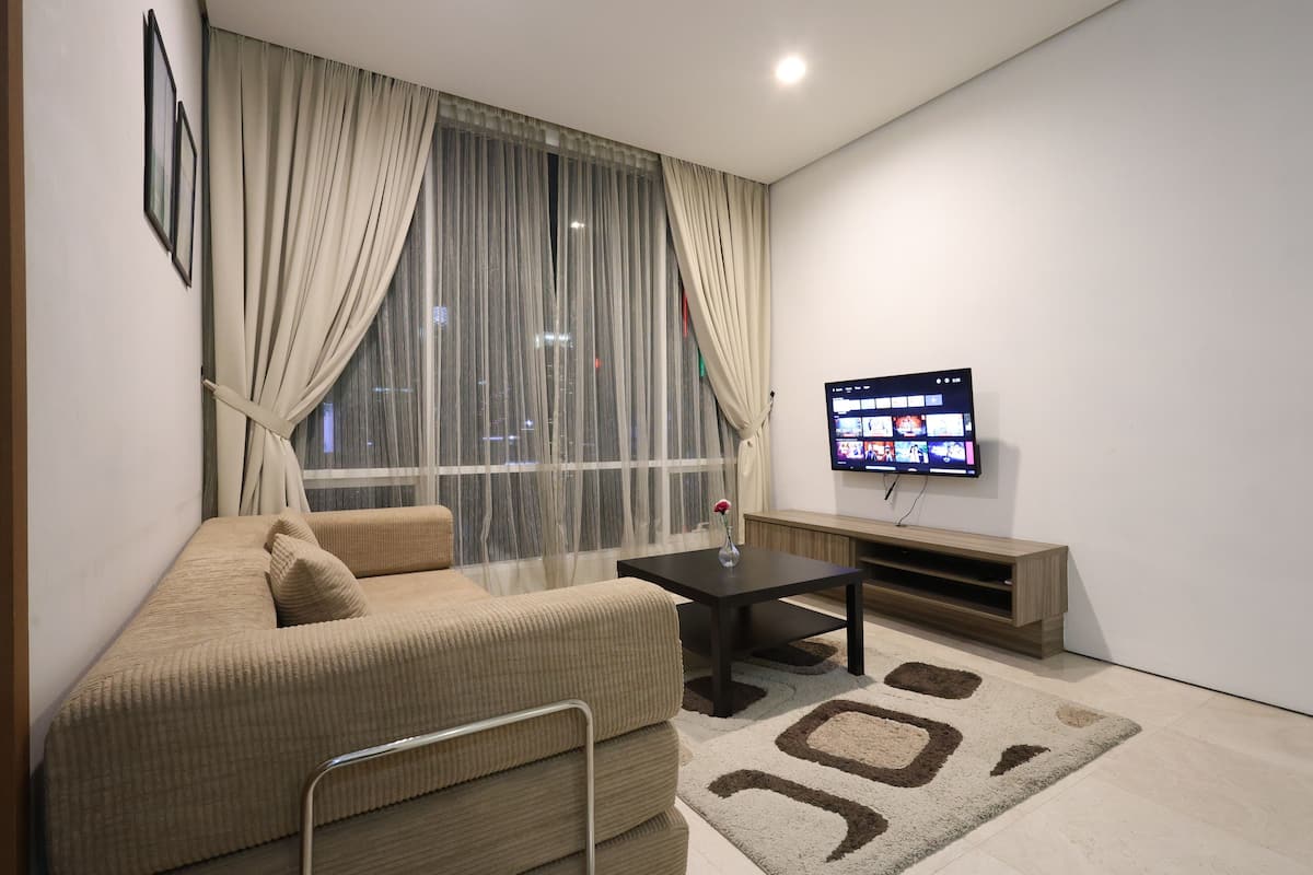 Economy Apartment | Living area | 40-inch Smart TV with digital channels, Netflix, streaming services
