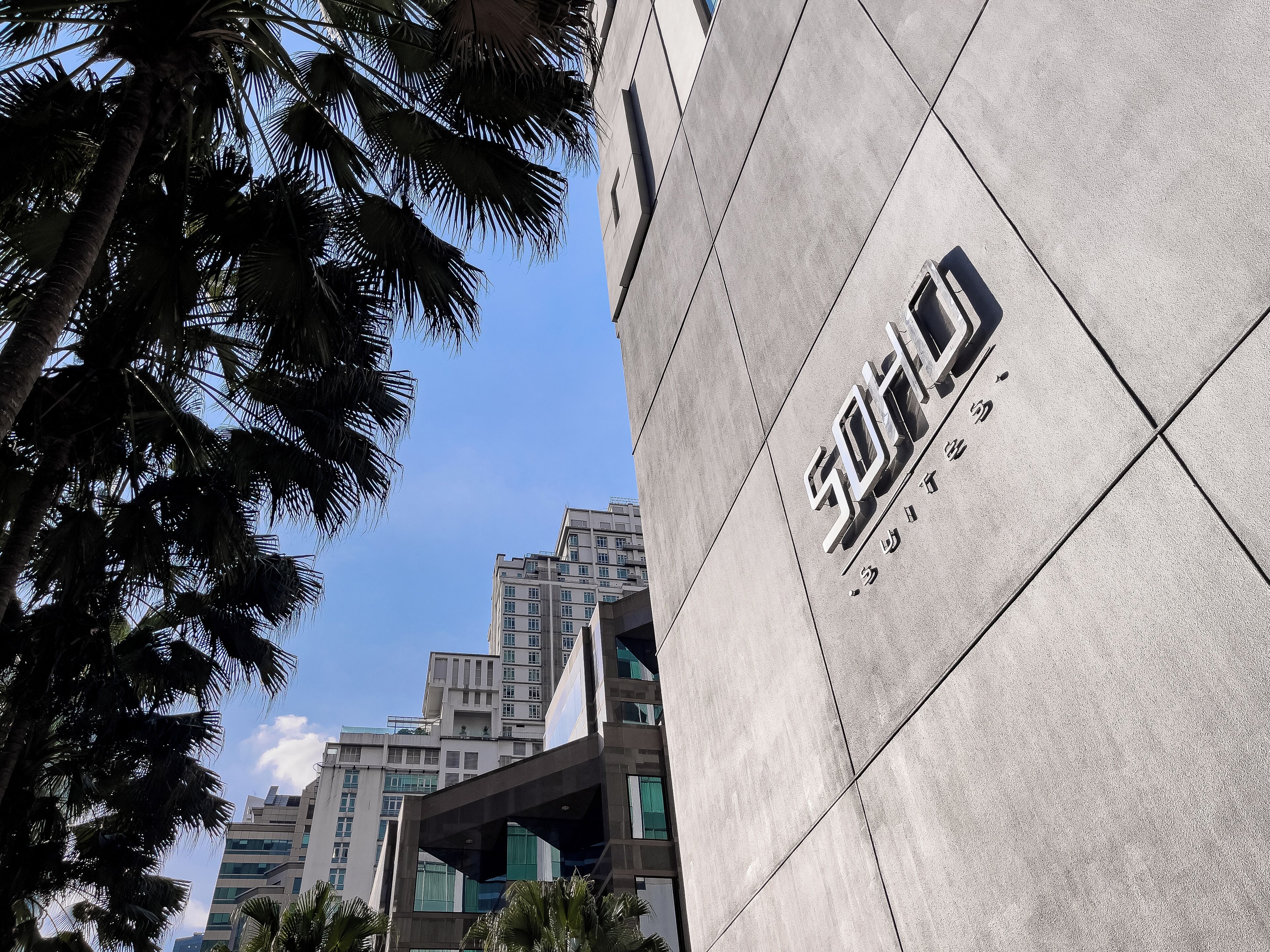 A modern building with a prominent sign.