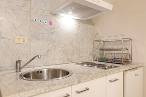 Apartment | Private kitchenette | Electric kettle, dining tables - Appartamento piccolo by Wonderful Italy (Bologna)