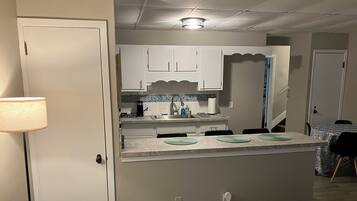 Fridge, microwave, stovetop, cookware/dishes/utensils