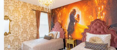 A bedroom with two beds, a chandelier, and a large mural on the wall.
