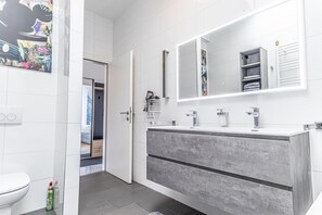 Shower, hair dryer, towels, soap