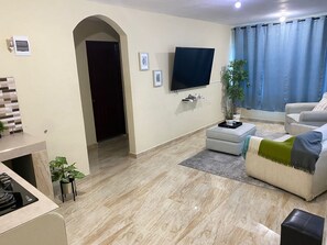 Living area - Hermoso y acogedor apartamento a solo 10 minutos del aeropuerto Las Américas. (Santo Domingo Este)