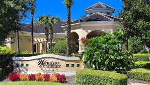A building with a sign reading "Windsor Hills Clubhouse." - Summer Dreams 3 Bed Condo in Windsor Hills Resort (Kissimmee)