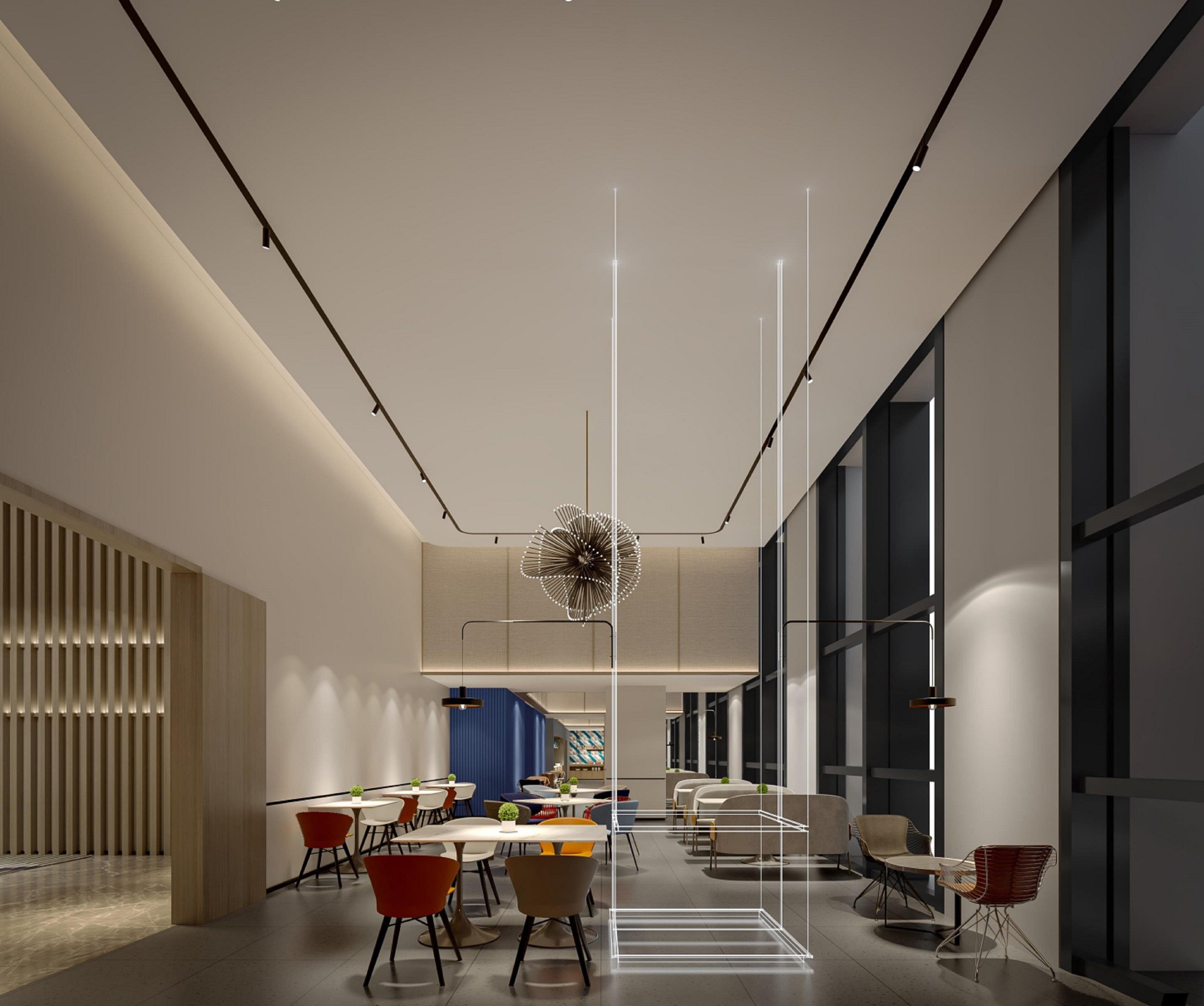 Un espace de restauration moderne, avec des tables et des chaises, un luminaire décoratif et de grandes fenêtres.