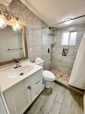 Shower, hair dryer, towels, soap