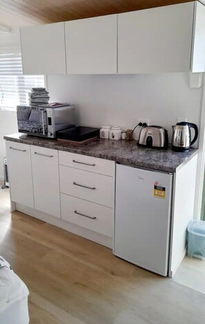 Microwave, toaster, dining tables