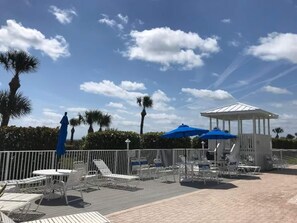 Outdoor dining - Penthouse with ocean views steps to private beach in a gated community (Cape Canaveral)