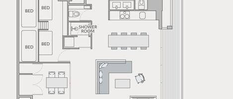 A floor plan of a hotel room with a balcony, a bathroom, a shower room, and a dining area.